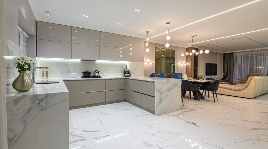 Luxury large modern white marble kitchen united with dining room and living room